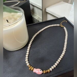Elegant Pearl and Gold Necklace with Pink Fish Accent